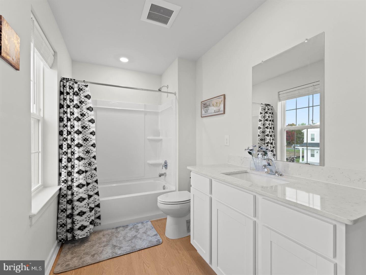 12 Handbell Lane Sicklerville, NJ 08081 - Photo 23 of 30 a bathroom with a sink a toilet a shower and a mirror
