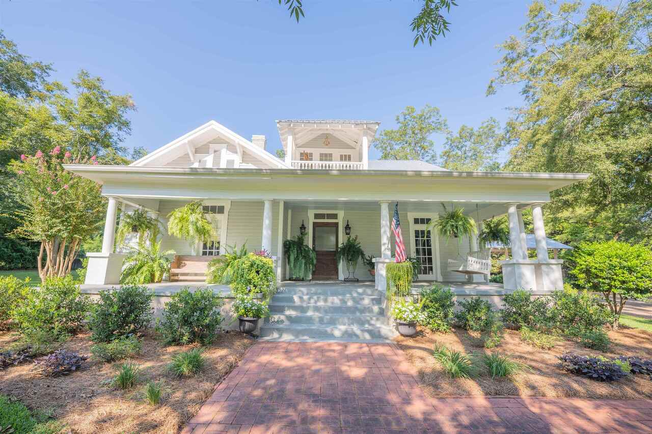 1081 Eatonton Road Madison, GA 30650 - Photo 1 of 1 a front view of a house with garden