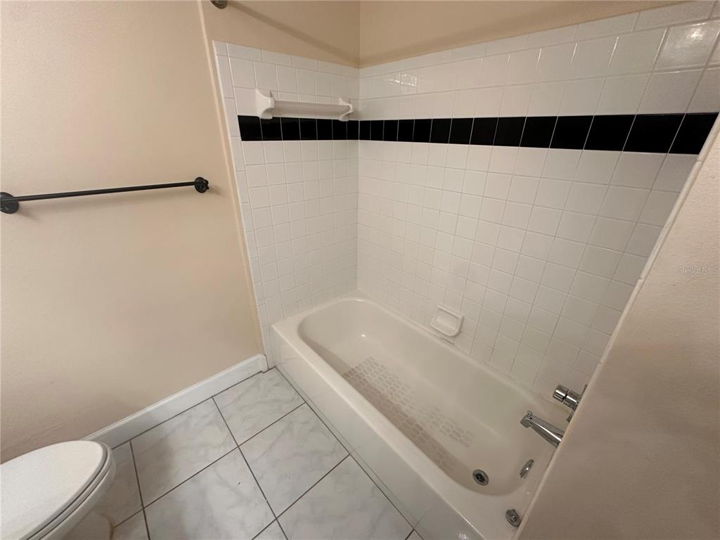 709 Bloom Street, Unit 240 Celebration, FL 34747 - Photo 11 of 17 a bathroom with a shower and a toilet