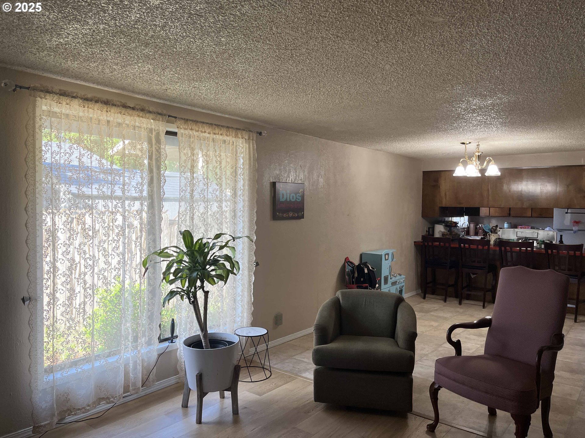 2215 24th Street Florence, OR 97439 - Photo 11 of 31 a living room with furniture and a large window