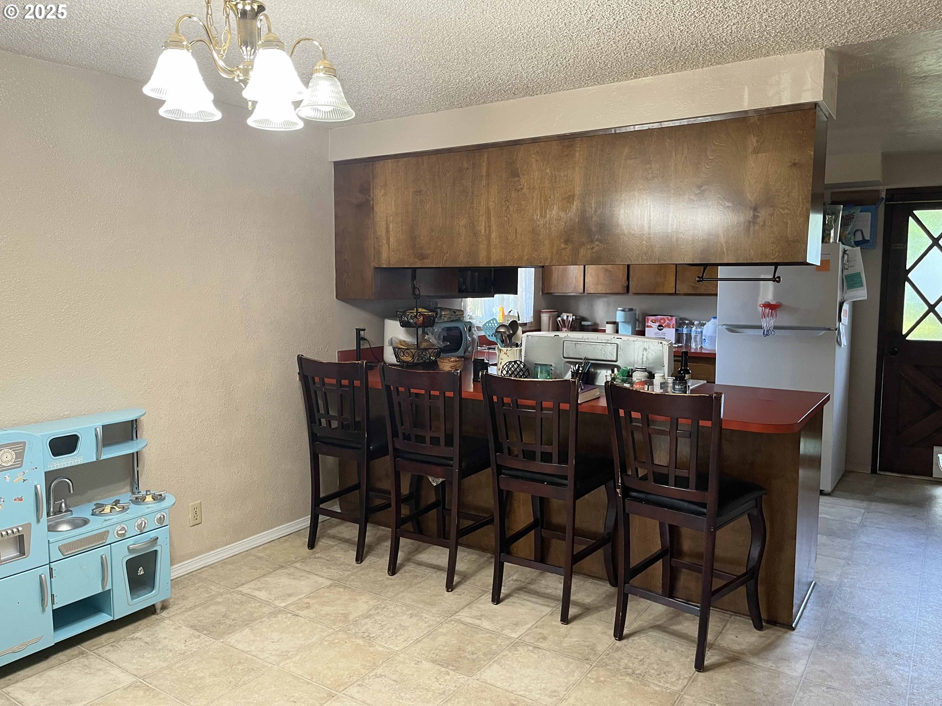 2215 24th Street Florence, OR 97439 - Photo 13 of 31 a view of a dining room with furniture