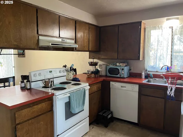 a white refrigerator freezer sitting in a kitchen