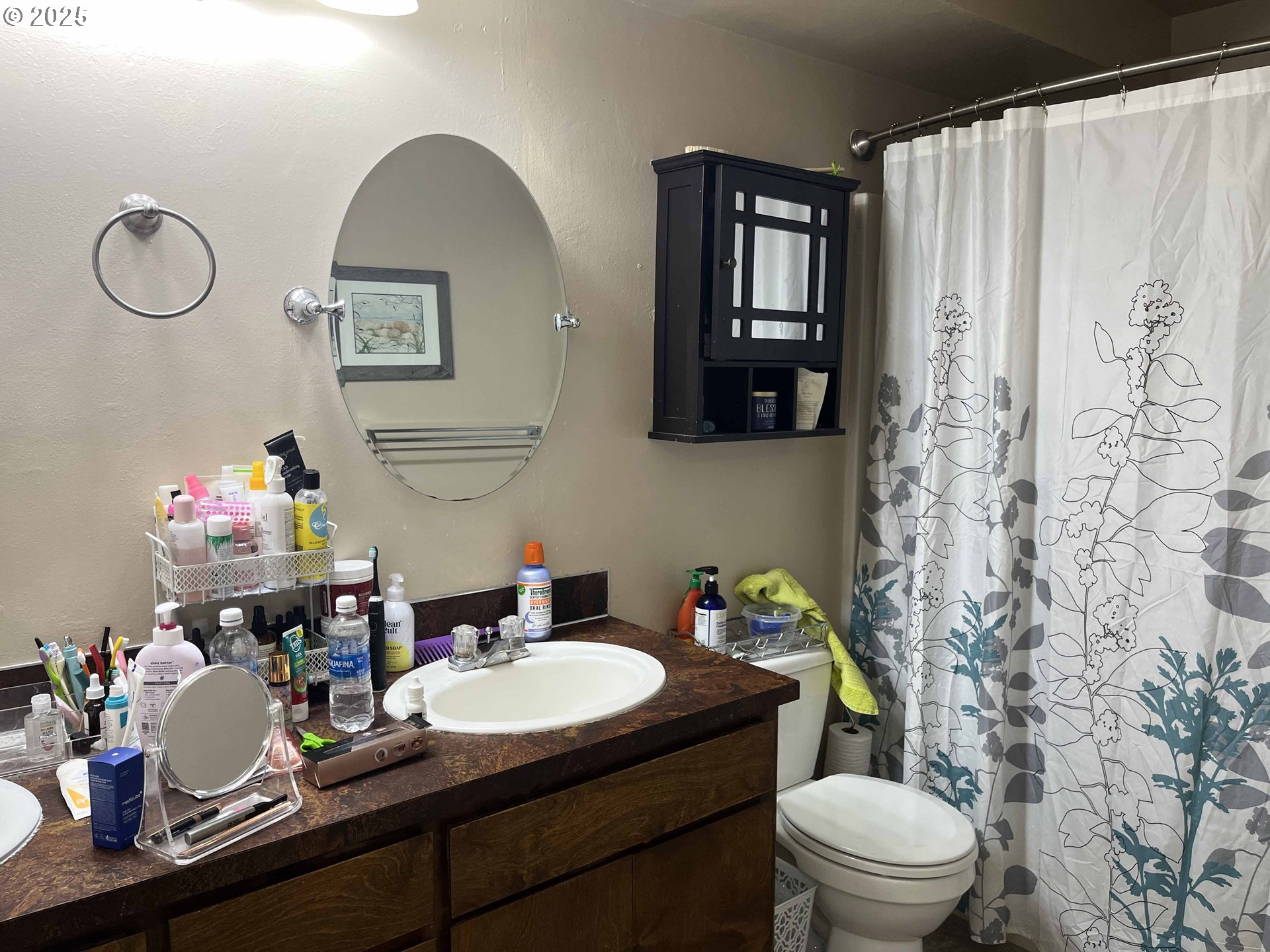 2215 24th Street Florence, OR 97439 - Photo 25 of 31 a bathroom with a granite countertop toilet sink and mirror