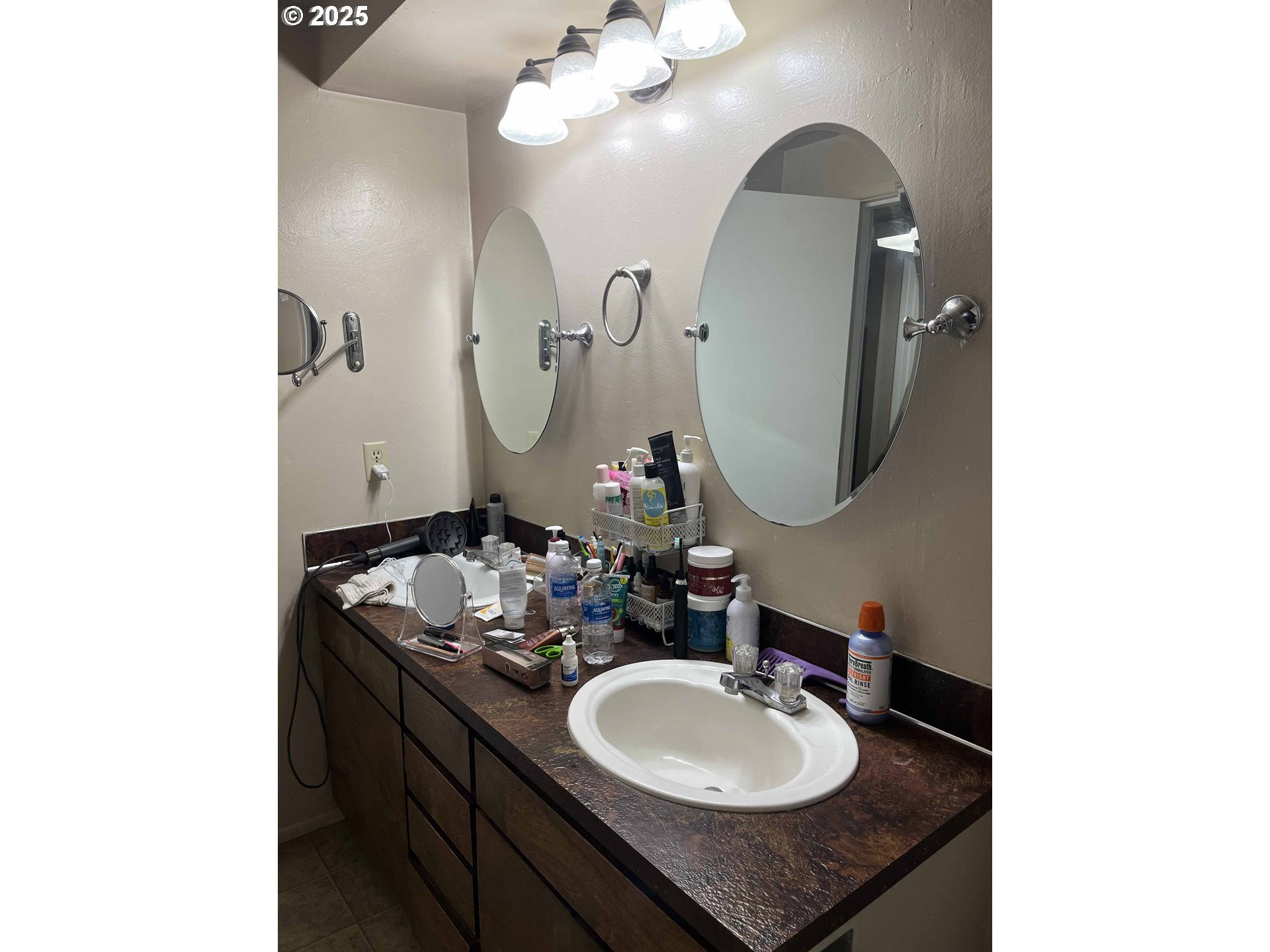 2215 24th Street Florence, OR 97439 - Photo 26 of 31 a bathroom with a sink and a mirror
