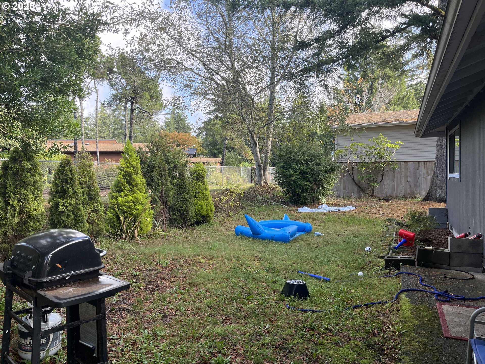 2215 24th Street Florence, OR 97439 - Photo 31 of 31 a view of a backyard with furniture
