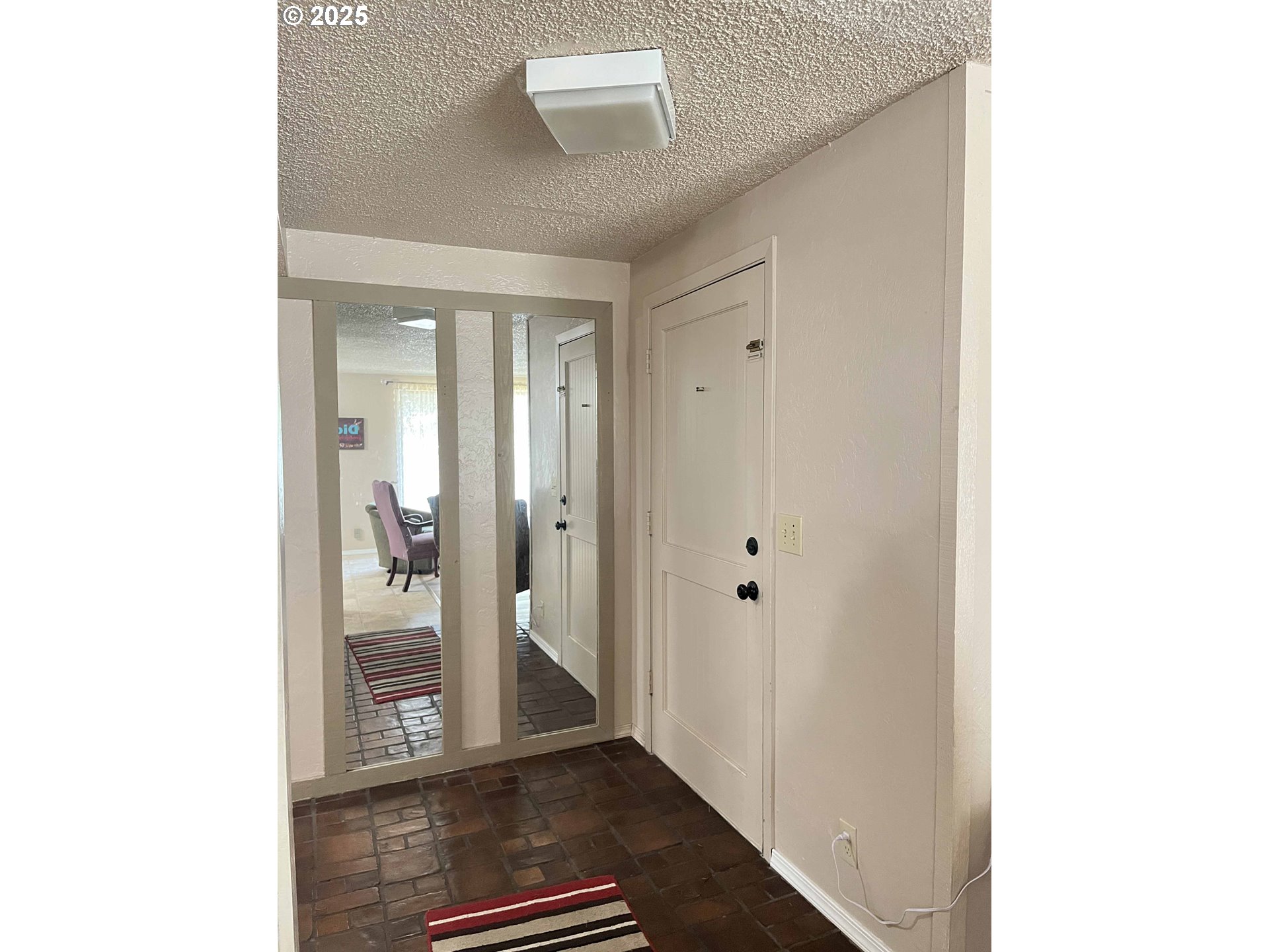 2215 24th Street Florence, OR 97439 - Photo 5 of 31 a view of a hallway with wooden floor