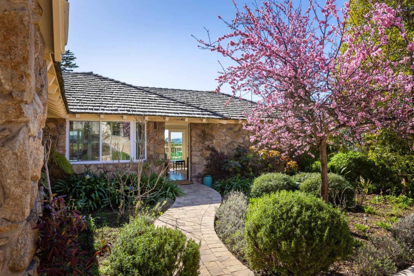 a front view of a house with garden
