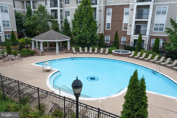 a view of a swimming pool with a patio