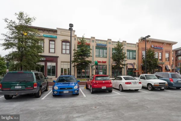 a view of a building with sitting area