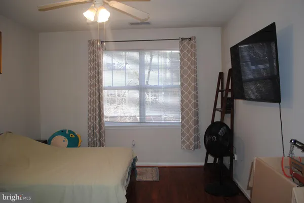 a room with window and furniture