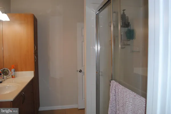 a bathroom with a sink and mirror