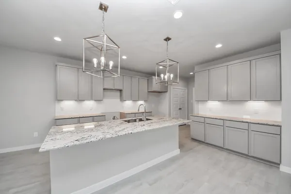 a kitchen with a sink and a refrigerator