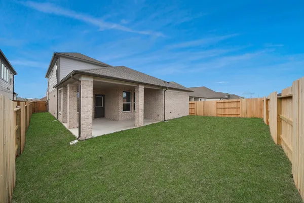 a view of a backyard with ceiling fan