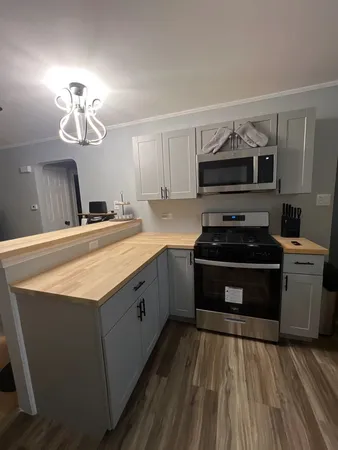a kitchen with a stove and a sink