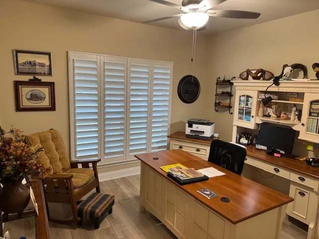 a view of a workspace with furniture