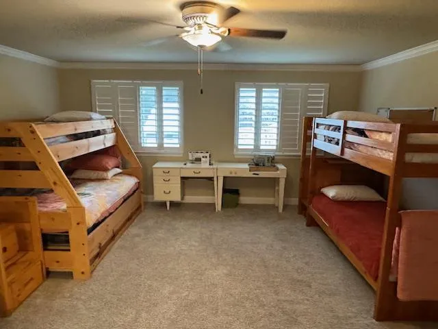 a bedroom with furniture and a chandelier