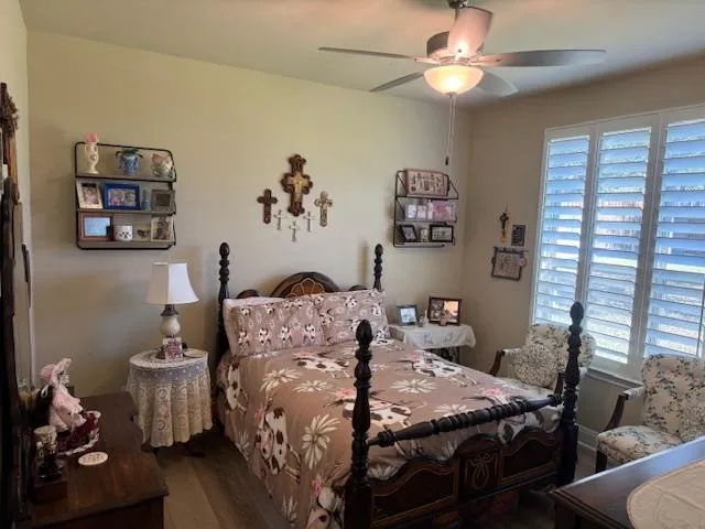a bed room with a bed and a chandelier