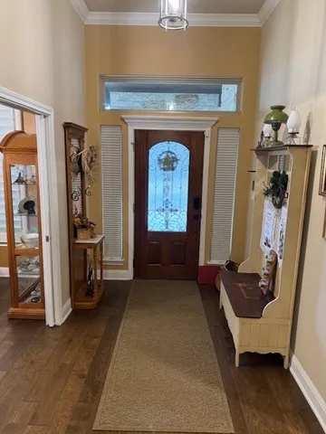 a hallway with a door and a couch