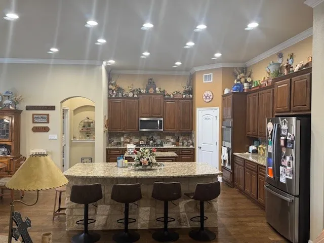 a view of kitchen island dining table and chairs