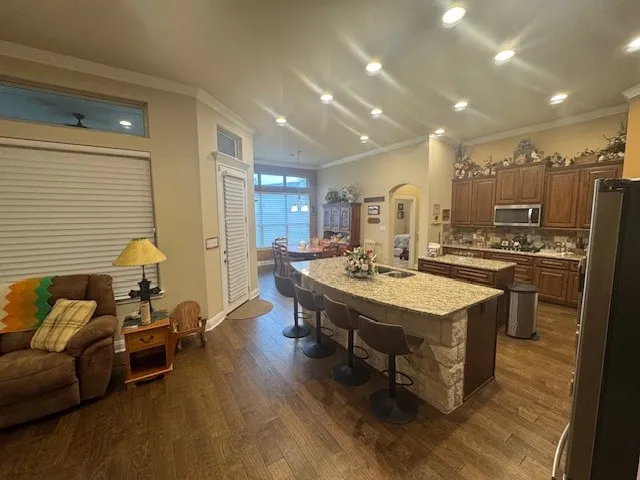 a large kitchen with a table and chairs