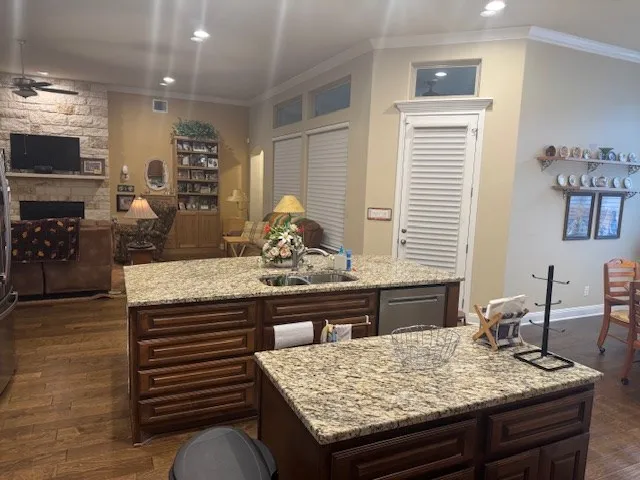 a kitchen with a table chairs and flat screen tv