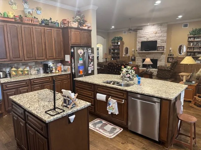 a kitchen with a stove a sink and a refrigerator