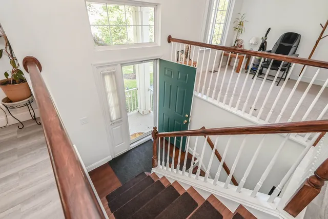 a view of stairs and with wooden floor