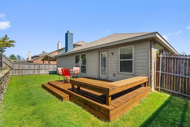 a blue and white bench sitting in front of a house