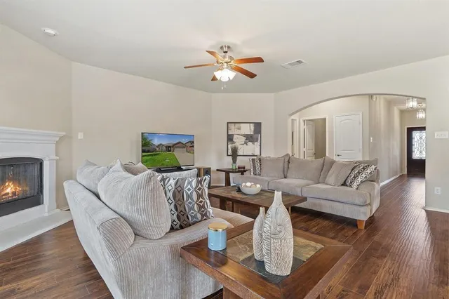 a living room with furniture and a fireplace