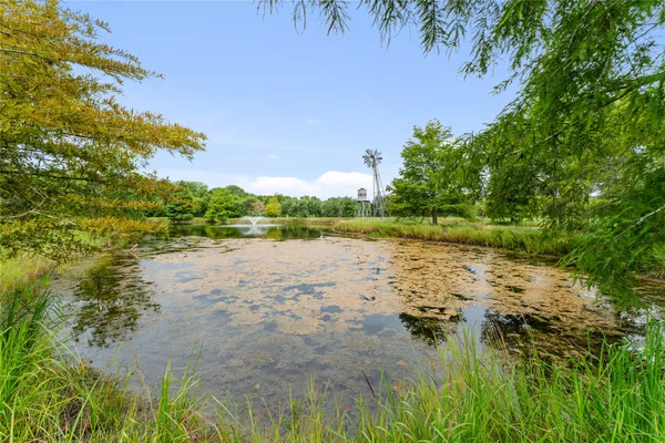 a large room with lots of furniture and a chandelier