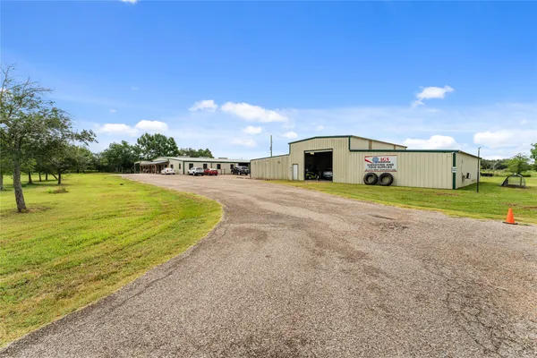 a dining room with furniture and a flat screen tv