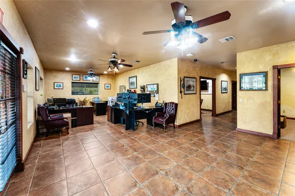 a workspace with furniture and chandelier