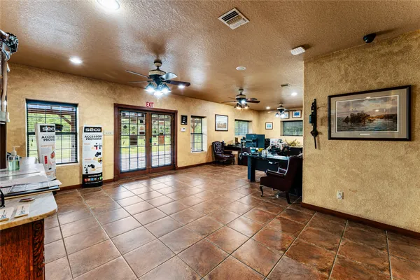 a view of a workspace with furniture