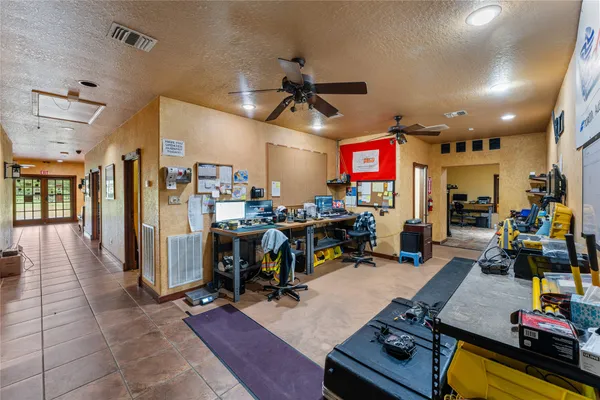 a kitchen with a refrigerator a stove top oven a sink dishwasher and a refrigerator with wooden floor