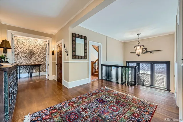 a living room with furniture and a rug