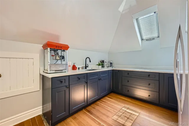 a kitchen with stainless steel appliances granite countertop a sink and cabinets