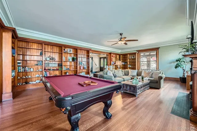 a living room with furniture a rug and a large window