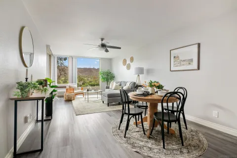 a view of a dining room with furniture window and wooden floor