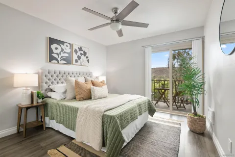 a bedroom with a large bed and a large window