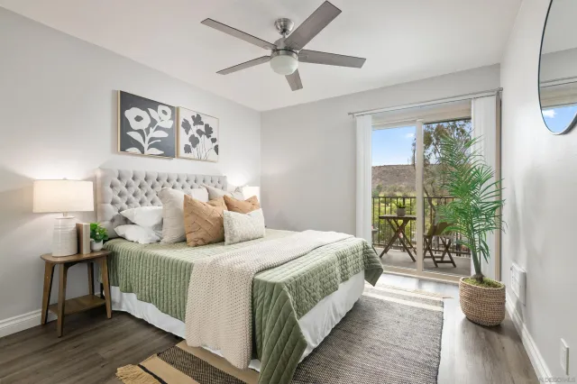 a bedroom with a large bed and a large window