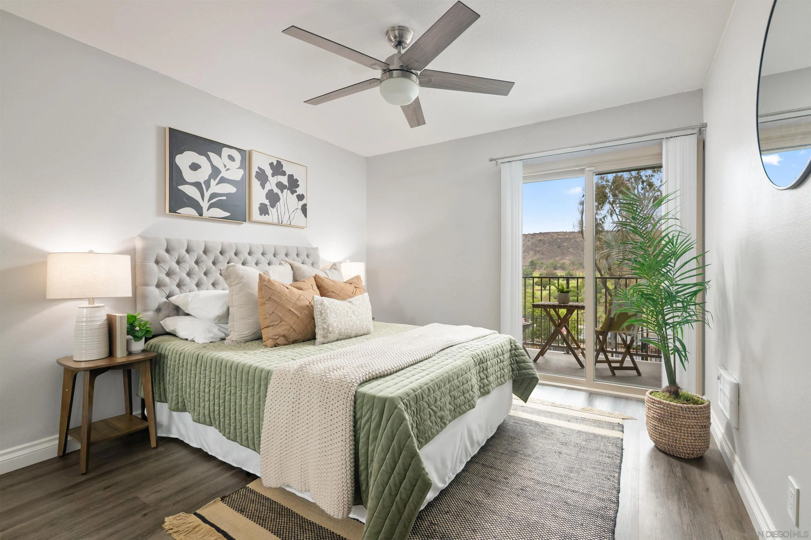 6675 Mission Gorge Road, Unit B104 San Diego, CA 92120 - Photo 7 of 14 a bedroom with a large bed and a large window