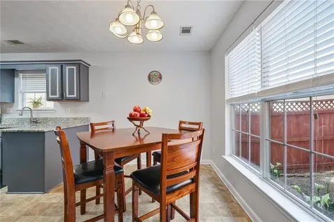 a view of a dining room with furniture window and outside view