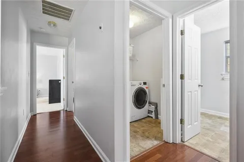 a view of a bathroom from a hallway