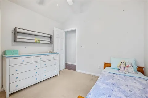 a bedroom with a bed and a dresser