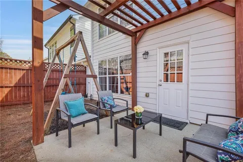 a backyard of a house with outdoor seating