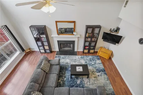 a living room with furniture and a fireplace
