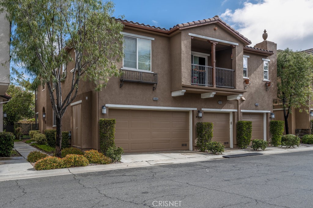 19435 Opal Lane Saugus, CA 91350 - Photo 1 of 1 front view of house with a yard