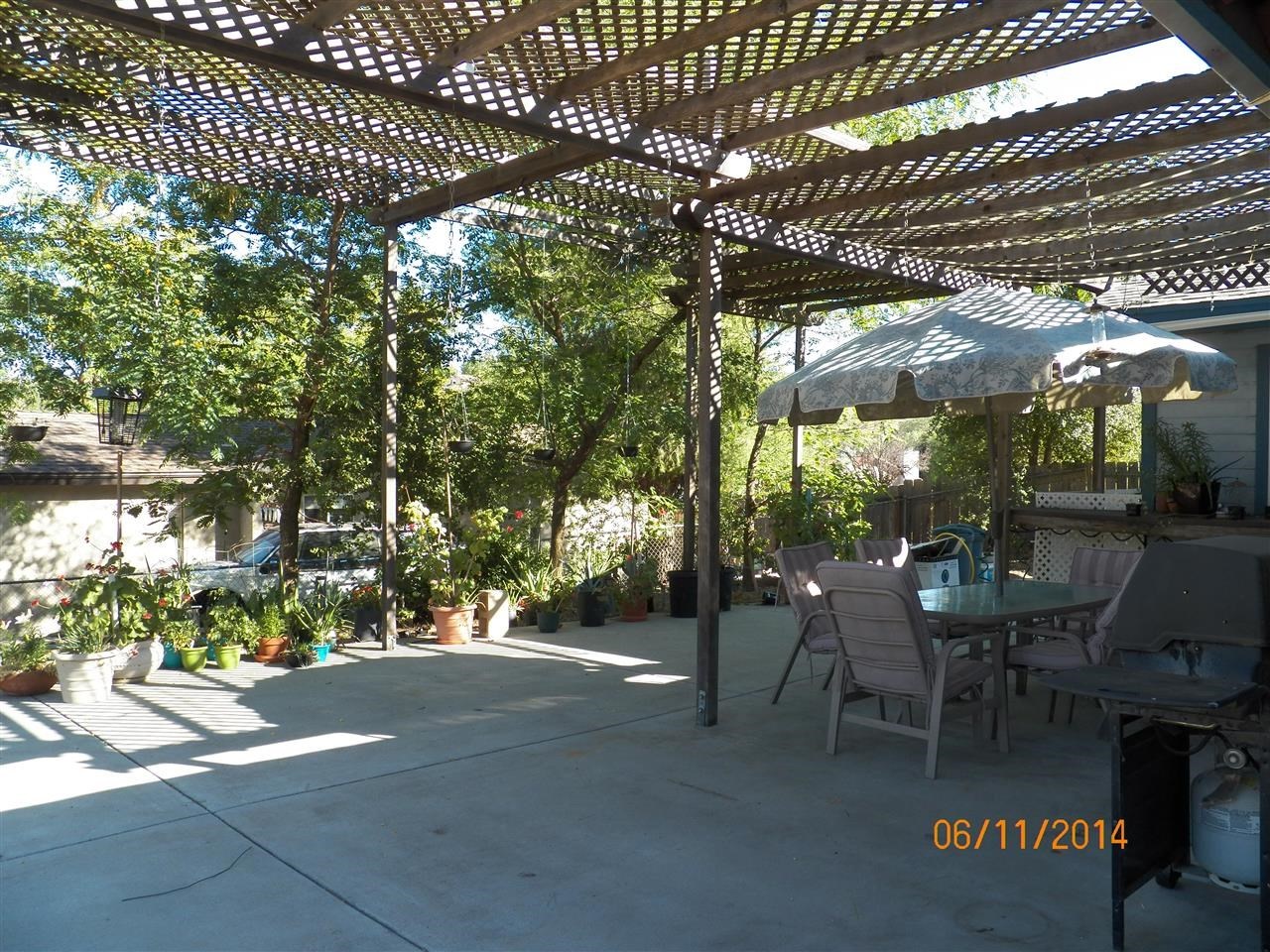 24952 Pappas Road Ramona, CA 92065 - Photo 17 of 21 Back Patio for relaxing, entertaining and to enjoy the nice breezes under the shady trees!!