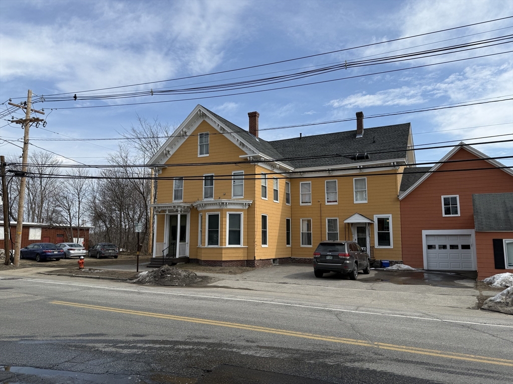 273-279 South Main Street Concord, NH 03301 - Photo 3 of 25 a view of a building with a car parked on the road
