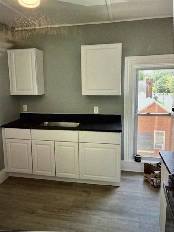 273-279 South Main Street Concord, NH 03301 - Photo 6 of 25 a kitchen with a cabinets and window